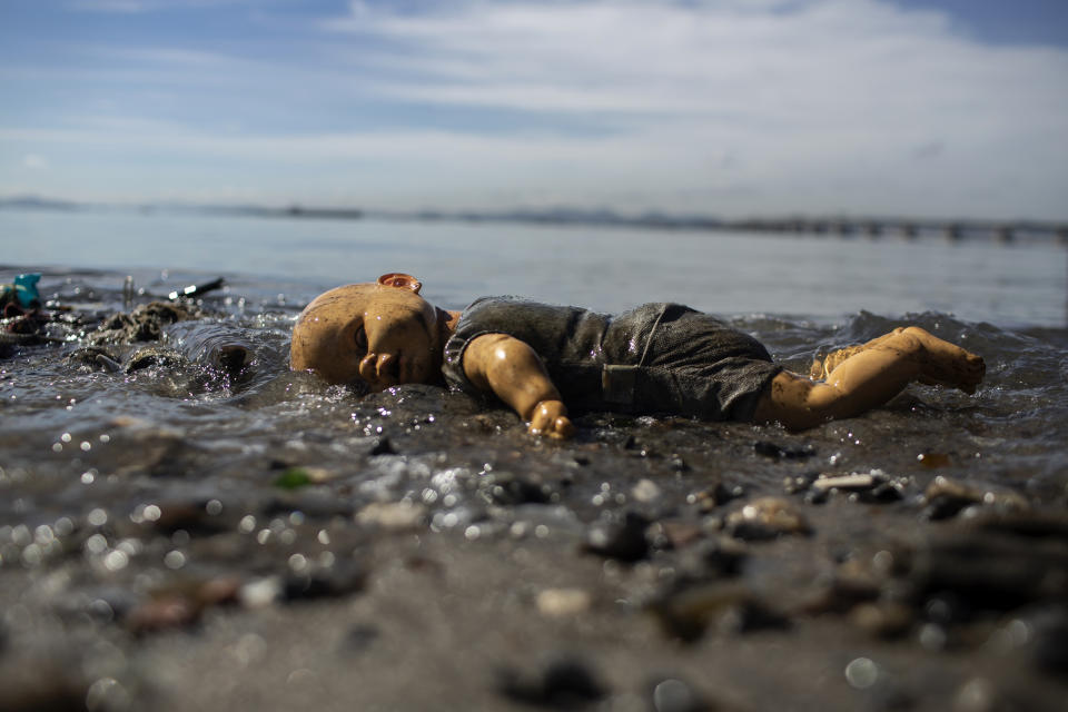 A discarded doll lays atop trash littering the coast of Guanabara Bay in Rio de Janeiro, Brazil, Thursday, June 24, 2021. Demolition of an elevated highway allowed for sweeping views of the bay where the 2016 Rio de Janeiro Olympics sailing competitions took place, but its waters weren’t cleaned of sewage, as had been promised. (AP Photo/Bruna Prado)