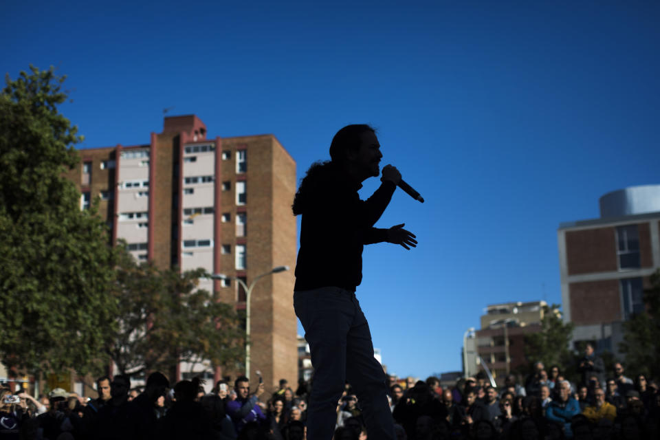 In this Wednesday, April 24, 2019 photo, Podemos party leader Pablo Iglesias, talks to his supporters as he takes part in an electoral meeting in Barcelona, Spain. Five years ago Pablo Iglesias was supposed to lead a leftist takeover of Spain. Now, the pony-tailed former TV politics commentator is struggling to keep his far-left United We Can party from breaking apart. (AP Photo/Emilio Morenatti)