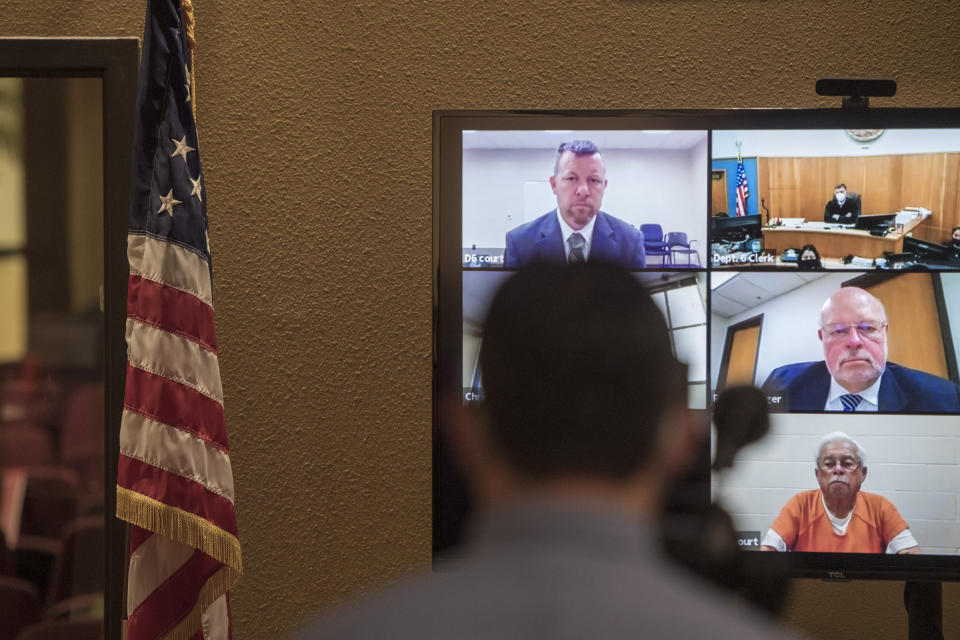 FILE - In this Thursday, April 15, 2021, file photo, defendants Paul Flores, top left, and his father, Ruben Flores, bottom right, appear via video conference during their arraignment in San Luis Obispo Superior Court in San Luis Obispo, Calif. The father and son were arrested on Tuesday, April 13, 2021, in connection with the 1996 disappearance of Kristin Smart, a college student at California Polytechnic University San Luis Obispo. The San Luis Obispo district attorney's office said that on Wednesday, July 14, 2021, it sought to add two rape charges for offenses after Smart disappeared to the complaint filed against Paul Flores in Smart's death. The judge ruled against the DA's motion. Flores was the last person seen with Smart on May 25, 1996, at California Polytechnic State University in San Luis Obispo. Her body has never been found. (AP Photo/Nic Coury, File)