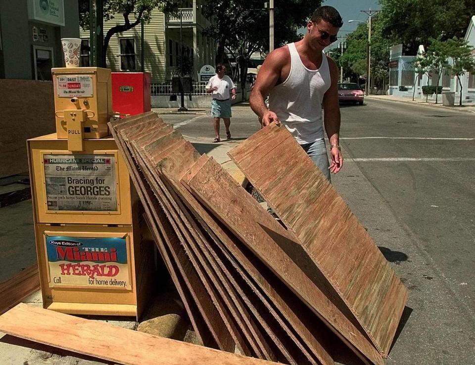 Hurricane Georges prep in Key West, Florida -- Eli Aroch boards up the Key West Gift Shop on Duval Street in preparation of Hurricane Georges in September 1998..