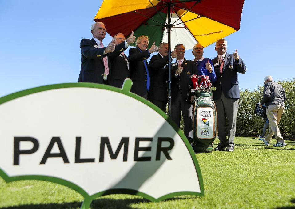 Arnold Palmer Invitational officials pose for a photo with Arnold Palmer's golf bag on Wednesday morning, March 15, 2017, at the Arnold Palmer Invitational golf tournament in Orlando, Fla. (Jacob Langston/Orlando Sentinel via AP)