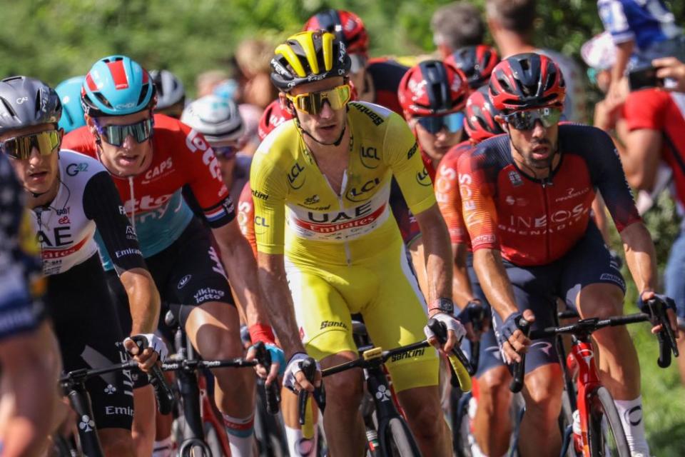 UAE Team Emirates British rider Adam Yates wearing the overall leaders yellow jersey cycles with the pack of riders in Hendaye during the 3rd stage of the 110th edition of the Tour de France cycling race 1935 km between AmorebietaEtxano in Northern Spain and Bayonne in southwestern France on July 3 2023 Photo by Thomas SAMSON  AFP Photo by THOMAS SAMSONAFP via Getty Images