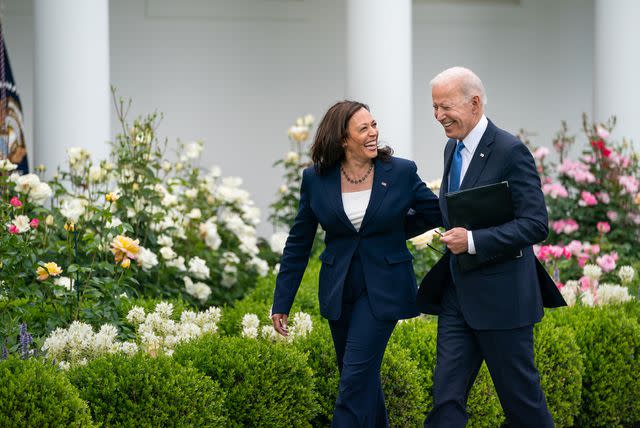 Official White House Photo by Adam Schultz Vice President Kamala Harris and President Joe Biden walk on the White House grounds after delivering remarks