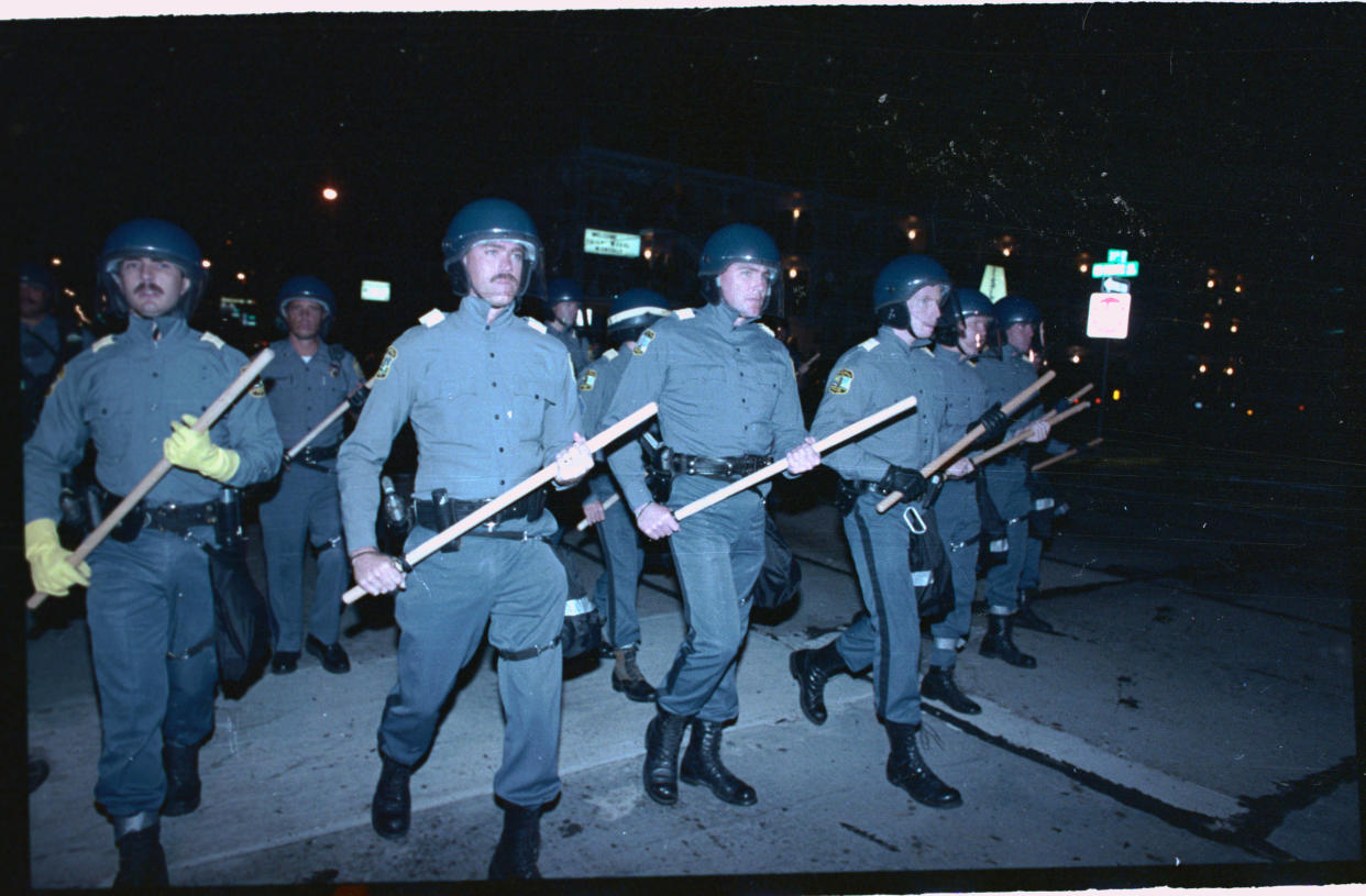 Virginia Beach, Virginia: Scores of police in riot gear prepare to move down Pacific Avenue, (September 4th), during the 2nd night of disturbances by students. 