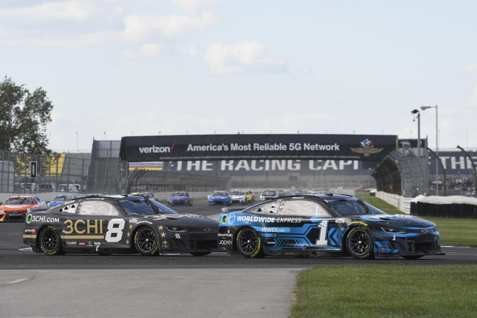 INDIANAPOLIS, IN - JULY 31: Ross Chastain (#1 TrackHouse Racing Worldwide Express Chevrolet) and Tyler Reddick (#8 Richard Childress Racing 3CHI Chevrolet) battle for the lead through turn seven in the closing laps of the NASCAR Cup Series Verizon 200 at the Brickyard on July 31, 2022, at the Indianapolis Motor Speedway Road Course in Indianapolis, Indiana. (Photo by Michael Allio/Icon Sportswire via Getty Images)