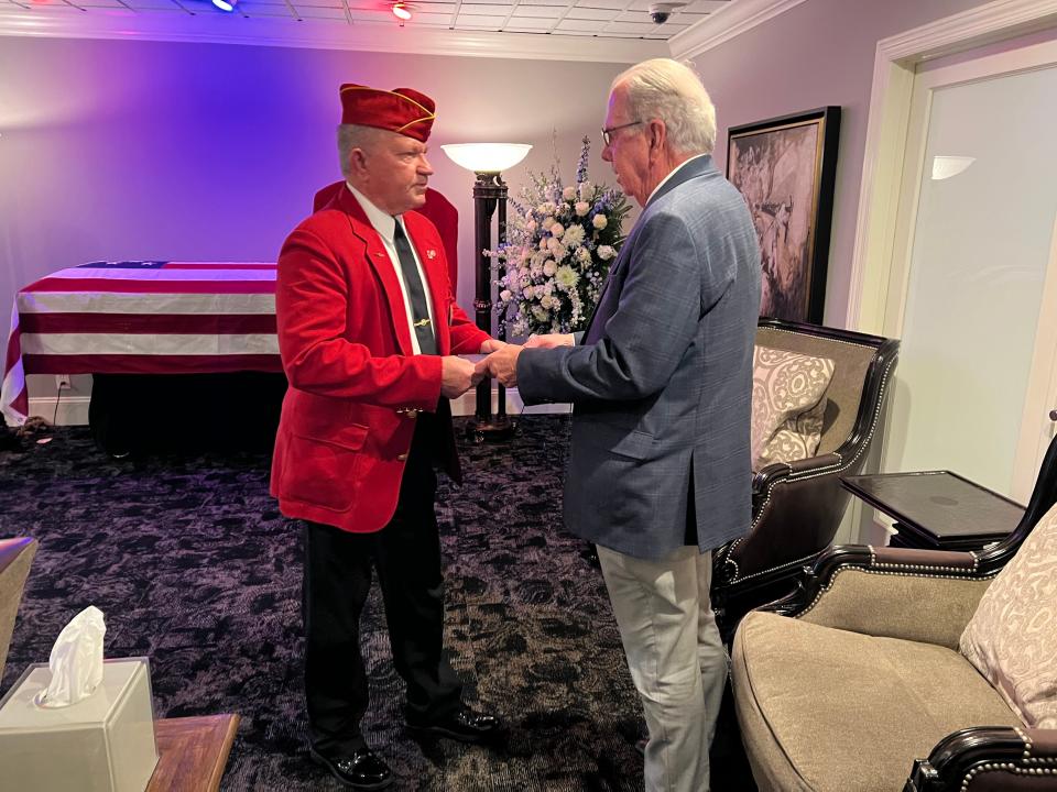 Anthony Westbooks, with the Music City Detachment 378 of the Marine Corps League, presents Jack Waggener with a certificate honoring the life and sacrifice Cpl. William Ragsdale made while fighting in the Pacific Theater of WWII.