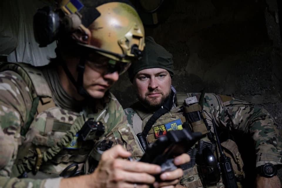 Ukrainian soldier Valentyn Ilchuk, call sign Burzhui, monitors a colleague's drone near the front line. (Valentyn Ilchuk)