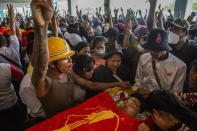 Women grieve as they view the body of Zwee Htet Soe, a protester who died during a Mar. 3 anti-coup protest, during his funeral in Yangon, Myanmar, Friday, Mar. 5, 2021. Demonstrators defy growing violence by security forces and stage more anti-coup protests ahead of a special U.N. Security Council meeting on the country's political crisis. (AP Photo)