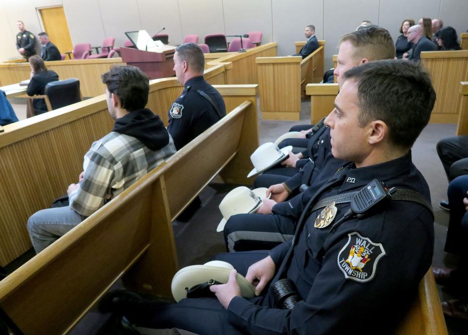 Former Wall Township Police Officers are shown in Judge Christie L. Bevacqua's courtroom during the sentencing for former Police Sergeant James Cadigan at the Monmouth County Courthouse in Freehold Wednesday, March 20, 2024. Cadigan was sentenced to five years in prison for stealing about $115,000 from a local Pop Warner football club where he was a coach and from his own PBA.