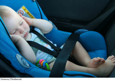 baby sleeping in a car seat