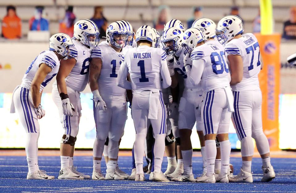 BYU quarterback Zach Wilson calls a play in the huddle as BYU and Boise State play a college football game at Albertsons Stadium in Boise on Friday, Nov. 6, 2020. BYU won 51-17. | Scott G Winterton, Deseret News