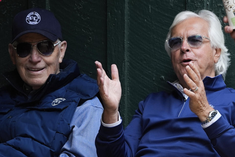 Horse trainers D. Wayne Lukas, left, and Bob Baffert talk ahead of the 149th running of the Preakness Stakes horse race at Pimlico Race Course, Friday, May 17, 2024, in Baltimore. (AP Photo/Julia Nikhinson)