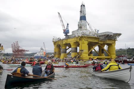 Activists protest the Shell Oil Company's drilling rig Polar Pioneer which is parked at Terminal 5 at the Port of Seattle, Washington May 16, 2015. REUTERS/Jason Redmond