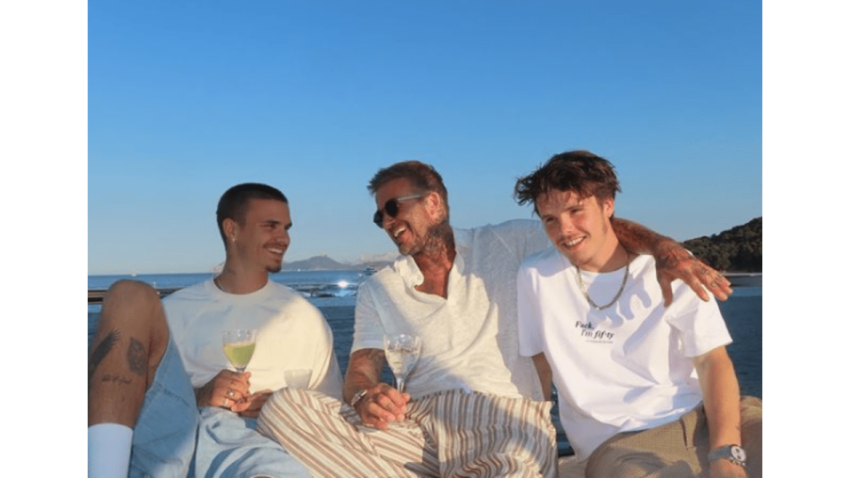 father with two sons on boat