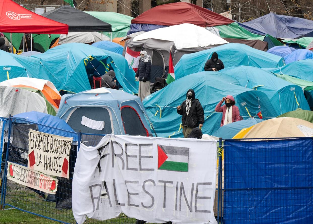 The pro-Palestinian activists began setting up the encampment on McGill University's downtown Montreal campus on April 27, and has grown in size since then. (Ryan Remiorz/The Canadian Press - image credit)