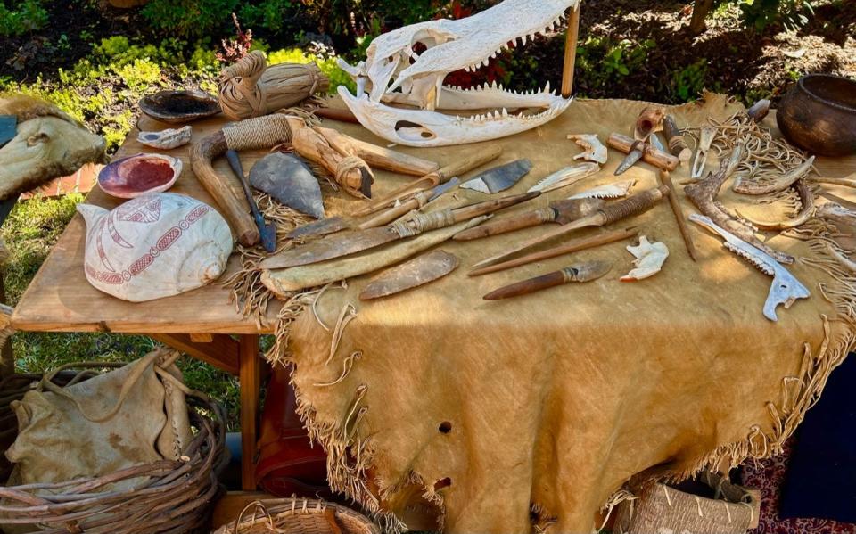 A display of indigenous tools at a recent Massie Heritage Center Native American Heritage Month celebration. Items shown are made of flint, wood and various animal bones.