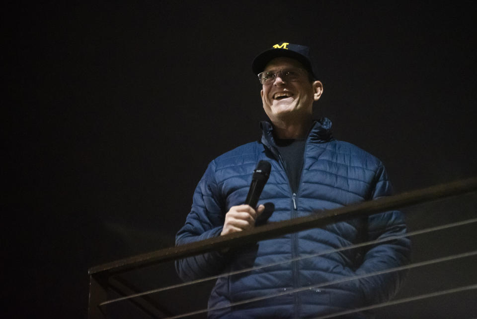 Michigan football coach Jim Harbaugh greets hundreds of fans as the football team is welcomed back after their national title win, Tuesday, Jan. 9, 2024 in Ann Arbor, Mich. (Katy Kildee/Detroit News via AP)
