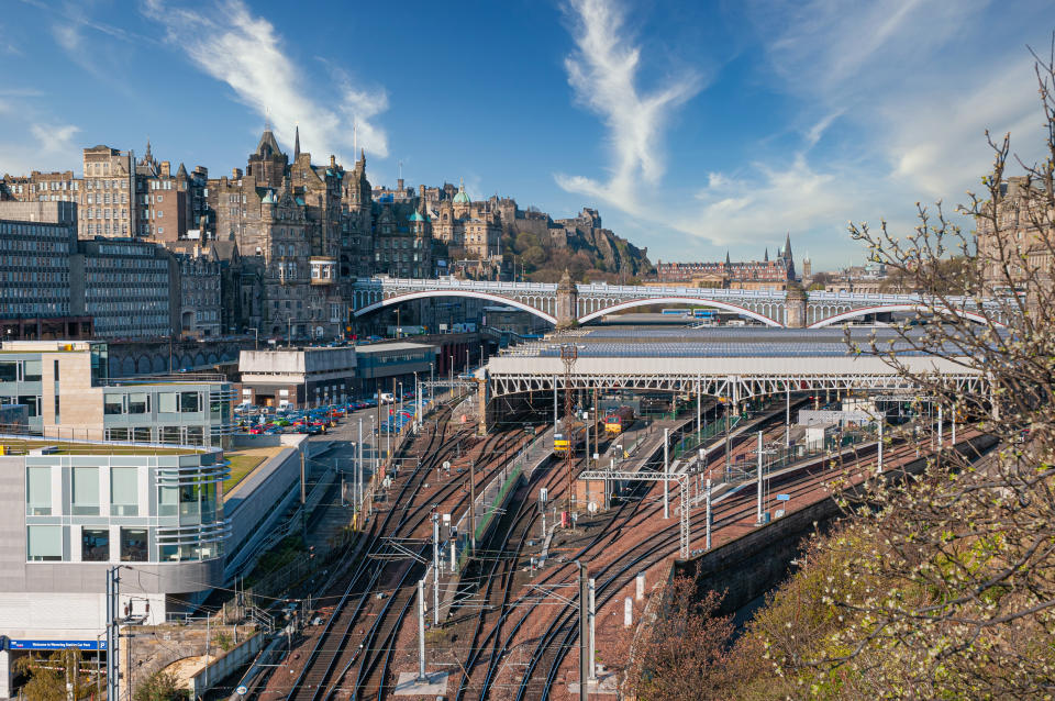 Looking down on the train tracks that lead in to Edinburgh's Waverley Station, with the Balmoral Hotel behind it