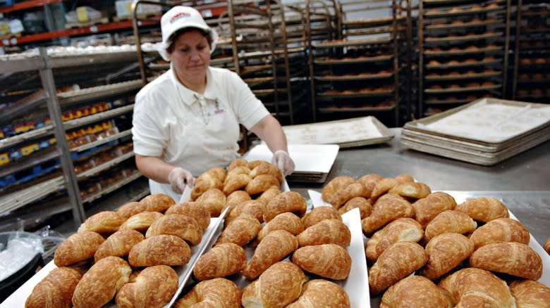 costco employee making croissants