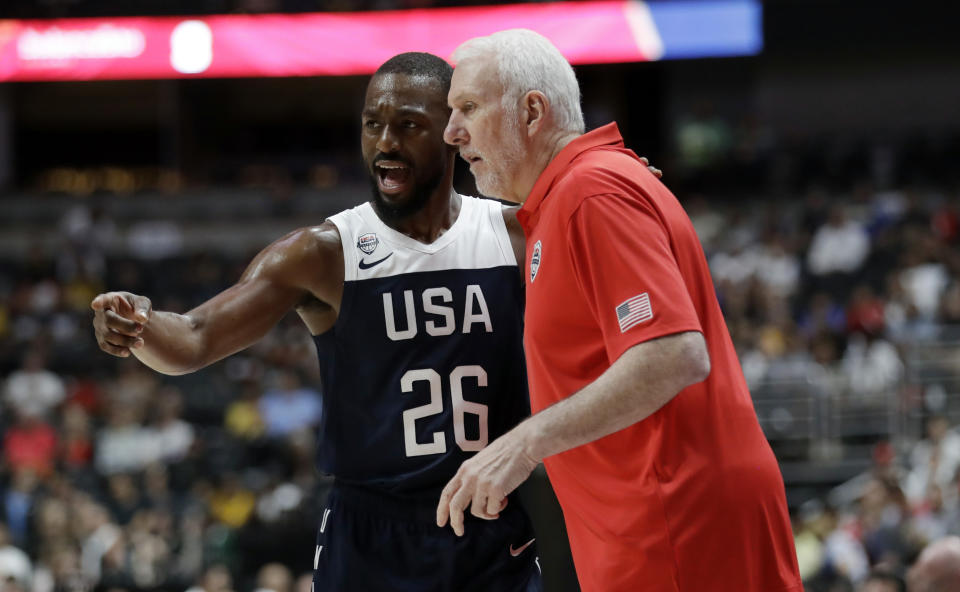 United States' Kemba Walker, left, talks to coach Gregg Popovich during the first half of the team's exhibition basketball game against Spain on Friday, Aug. 16, 2019, in Anaheim, Calif. (AP Photo/Marcio Jose Sanchez)
