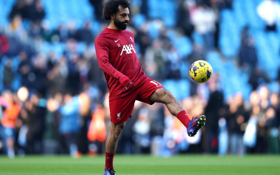 Liverpool's Egyptian striker #11 Mohamed Salah warms up ahead of the English Premier League football match between Manchester City and Liverpool