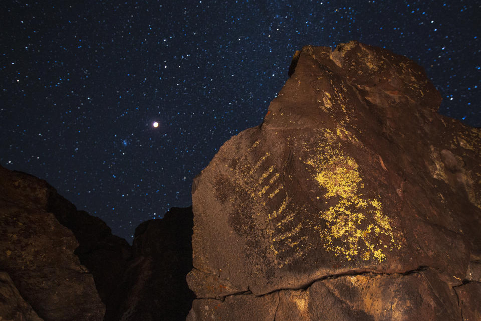 The total lunar eclipse and supermoon over ancient Native American petroglyphs on Jan. 20, near Barstow, California.