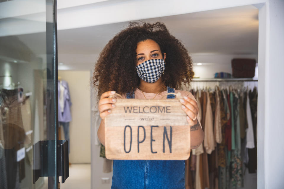 Open sign in a small business boutique shop after Covid-19 pandemic