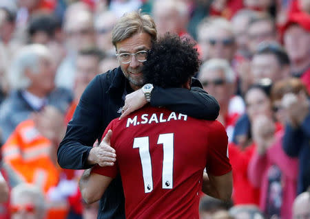 Soccer Football - Premier League - Liverpool vs Brighton & Hove Albion - Anfield, Liverpool, Britain - May 13, 2018 Liverpool's Mohamed Salah is hugged by manager Juergen Klopp as he is substituted Action Images via Reuters/Carl Recine
