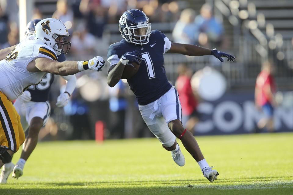 Connecticut wide receiver Keelan Marion (1) returns a punt against Wyoming during the first half of an NCAA football game on Saturday, Sept. 25, 2021, in East Hartford, Conn. | Stew Milne, Associated Press
