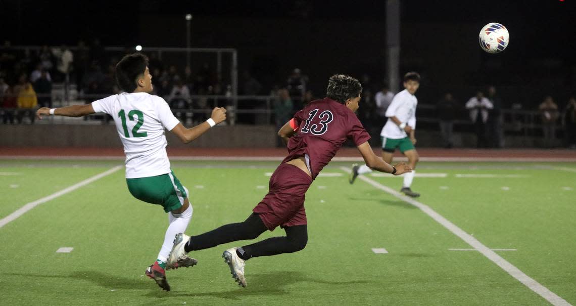 Riverdale High defender Michael García trips Matilda Torres’ Ray Saldana during the CIF Central Section Division V championship at Madera South on Feb. 24, 2024. Torres won, 1-0.