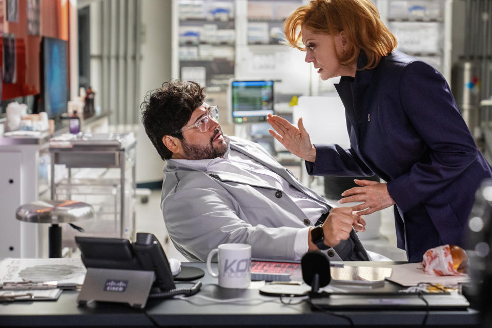 Harvey Guillén as Dr. Sanchez and Susan Sarandon as Victoria Kord in Blue Beetle