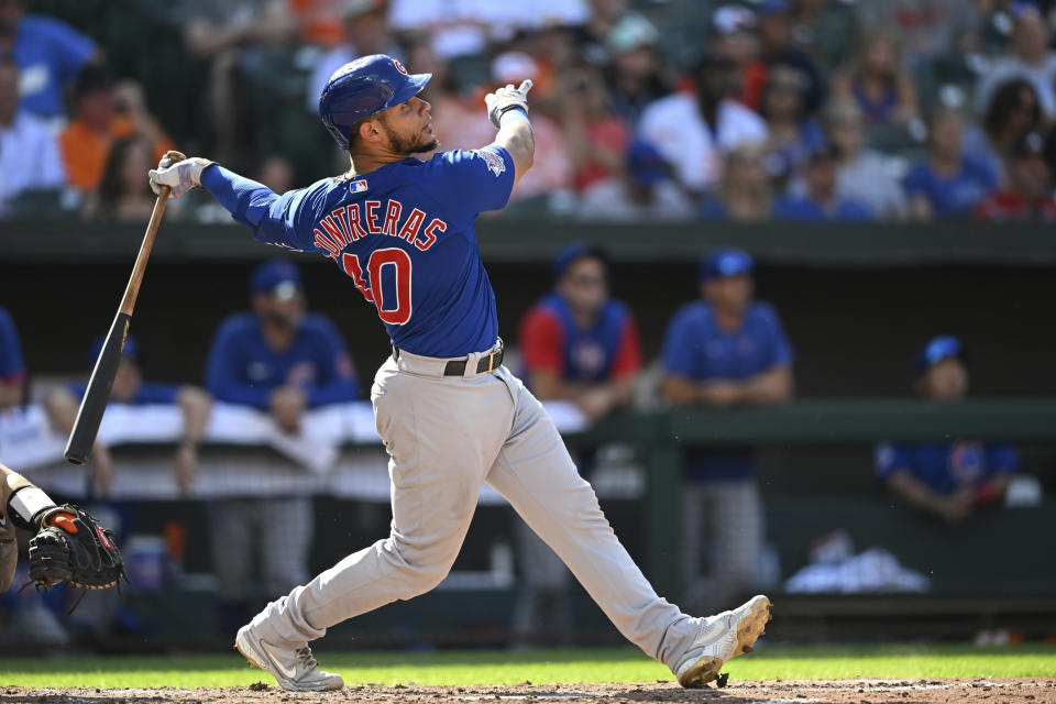 Chicago Cubs' Willson Contreras follows through on a solo home run against the Baltimore Orioles in the sixth inning of a baseball game, Thursday, Aug. 18, 2022, in Baltimore. (AP Photo/Gail Burton)