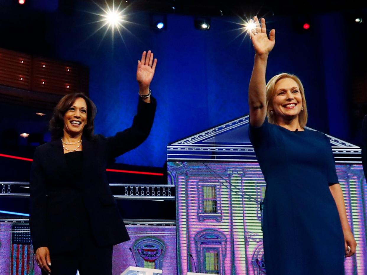 FILE - This June 27, 2019 file photo shows Democratic presidential candidates from left, former Colorado Gov. John Hickenlooper, entrepreneur Andrew Yang, South Bend Mayor Pete Buttigieg, former Vice-President Joe Biden, Sen. Bernie Sanders, I-Vt., Sen. Kamala Harris, D-Calif., Sen. Kirsten Gillibrand, D-N.Y., Colorado Sen. Michael Bennet and Rep. Eric Swalwell, D-Calif., on the second night of the Democratic primary debate hosted by NBC News in Miami. (AP Photo/Brynn Anderson, File)