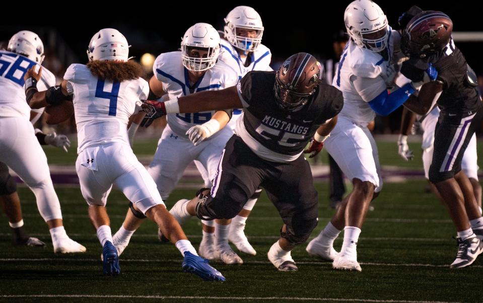 Lipscomb's Chauncey Gooden (55) can't get to IMG's Jayden Bradford (4) at Lipscomb's Reese Smith Football Field in Nashville, Tennessee, Friday night, August 18, 2023. IMG won the game 35-10 .