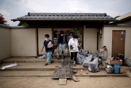 The damaged house of 51-year-old Kairyu Takahashi, an Okayams prefectural assemblyman, is seen in a flood affected area in Mabi town in Kurashiki, Okayama Prefecture, Japan, July 12, 2018. Picture taken July 12, 2018. REUTERS/Issei Kato