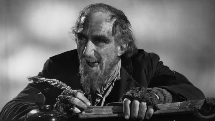 Ron Moody, as Fagin, writing in book in publicity portrait for the film &#39;Oliver!&#39;, 1968. (Photo by Columbia/Getty Images)