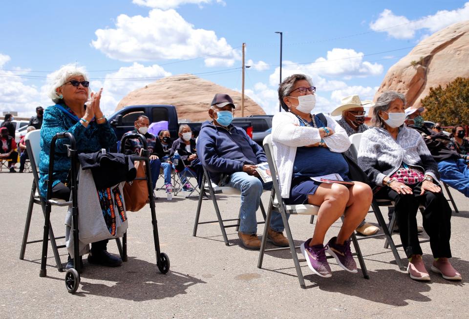 At left, Felda Yazzie from Tsé 'íí'áhí Chapter, claps during Buu Nygren's speech about seeking the tribal presidency on April 4 in Window Rock, Arizona.