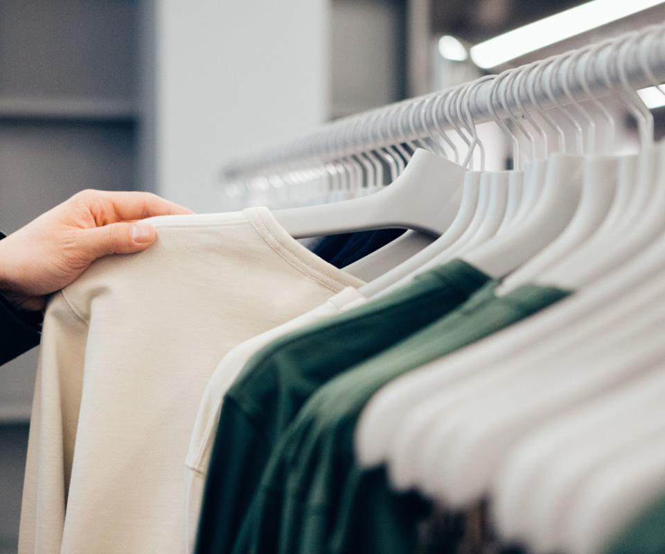 Clothes hanging neatly on a clothing rail