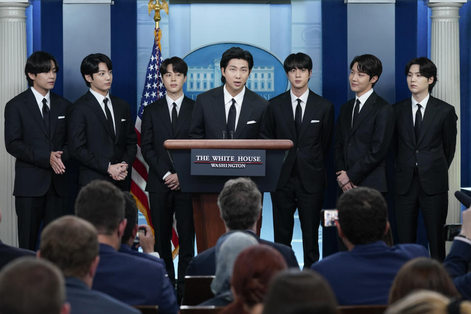 FILE - RM, center, accompanied by other K-pop supergroup BTS members from left, V, Jungkook, Jimin, Jin, J-Hope, and Suga speaks during the daily briefing at the White House in Washington, May 31, 2022. J-Hope entered a South Korean boot camp Tuesday, April 18, 2023 to start his 18-month compulsory military service, becoming the group’s second member to join the country's army. (AP Photo/Evan Vucci, File)