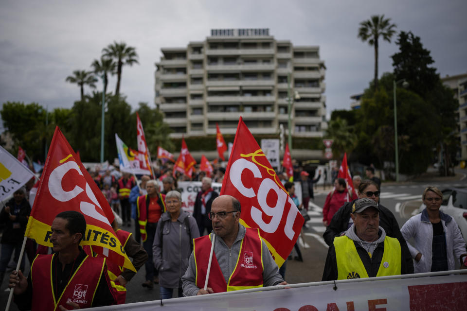 French union demonstrators protest President Emmanuel Macron's pension reform during the 76th edition of the Cannes Film Festival in Cannes, Sunday, May 21, 2023. (AP Photo/Daniel Cole)