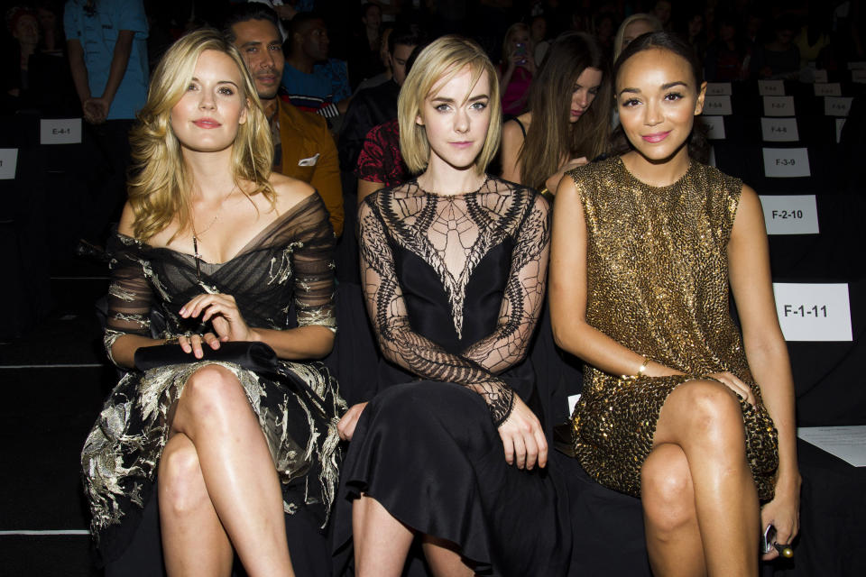 Maggie Grace, left, Jena Malone and Ashley Madekwe attend the Monique Lhuillier show on Saturday, Sept. 7, 2013, during Mercedes-Benz Fashion Week in New York. (Photo by Charles Sykes/Invision/AP)