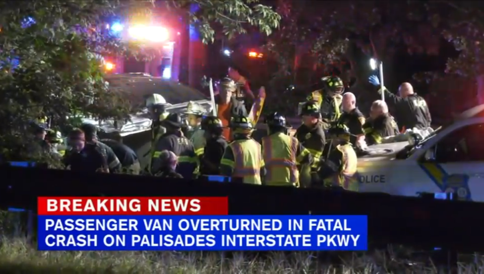 First responders extricate the dozen people found inside a crashed passenger van that flipped in the early hours on a New Jersey highway (ABC 7 New York/video screengrab)