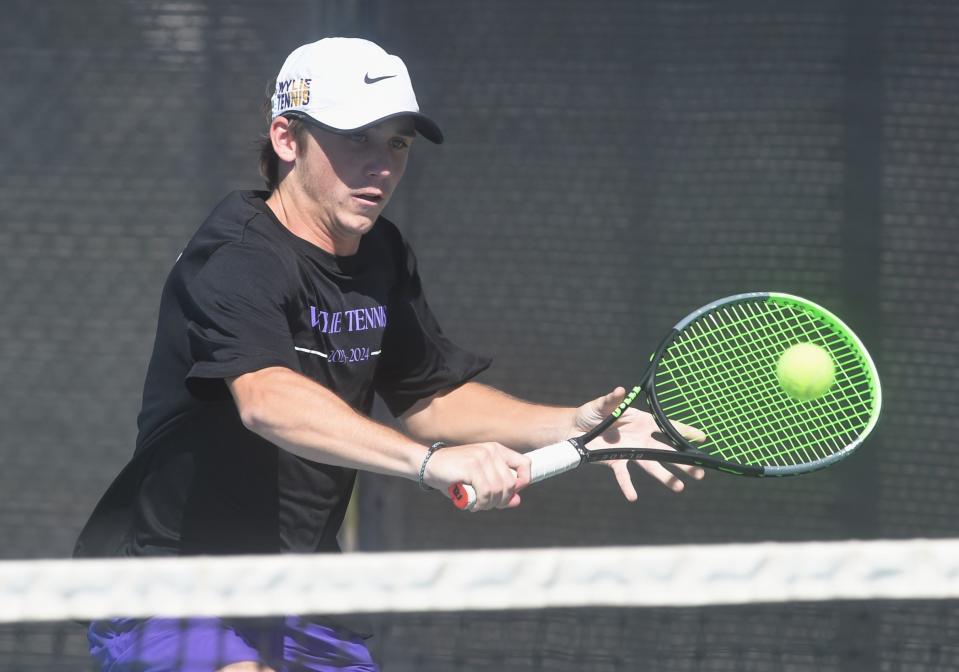 Wylie's Tate Heuerman returns a shot in the boys doubles match against Lubbock-Cooper's Brendan Lane and Braden Lane. Heureman and Talon Baker won the match 4-6, 6-4, 11-9, and Wylie beat the Pirates 10-0 in the Region I-5A quarterfinal team tennis match Tuesday at Hardin-Simmons' Streich Tennis Center.