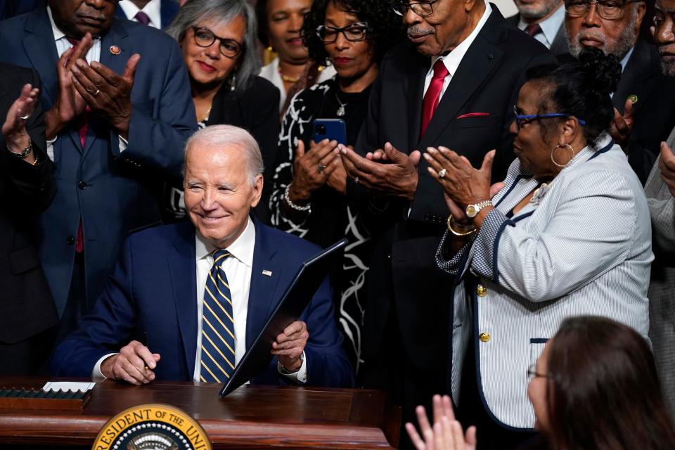 President Joe Biden signs a proclamation to establish the Emmett Till and Mamie Till-Mobley National Monument, in the Indian Treaty Room on the White House campus on Tuesday in Washington.