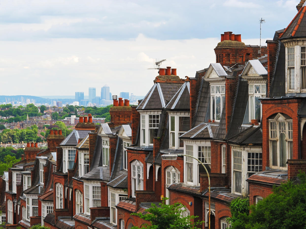 Red brick London Mansion Blocks with Canary Wharf . SHot taken from Muswell Hill.
