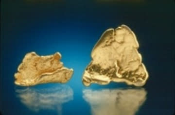 Pieces of gold pulled from the Ropes Gold Mine in Ishpeming Township. The largest piece is 1.5 centimeters across. (Courtesy MTU/A.E. Seaman Mineral Museum of Michigan)