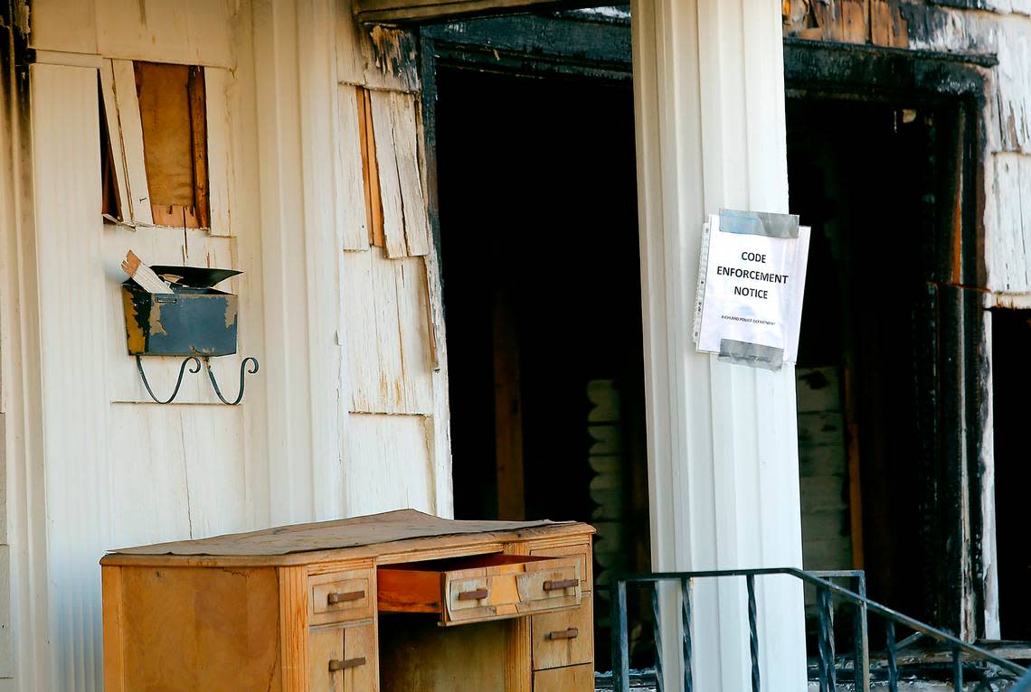 A code enforcement notice has been posted by the Richland Police Department at a dilapidated house destroyed by firein July 2020. Bob Brawdy/Tri-City Herald