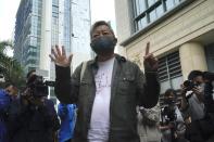 Pro-democracy activist Lee Cheuk-yan, gestures before his sentencing at a court in Hong Kong Friday, April 16, 2021. A Hong Kong court on Friday sentenced five leading pro-democracy advocates, including media tycoon Jimmy Lai, to up to 18 months in prison for organizing a march during the 2019 anti-government protests that triggered an overwhelming crackdown from Beijing. (AP Photo/Kin Cheung)