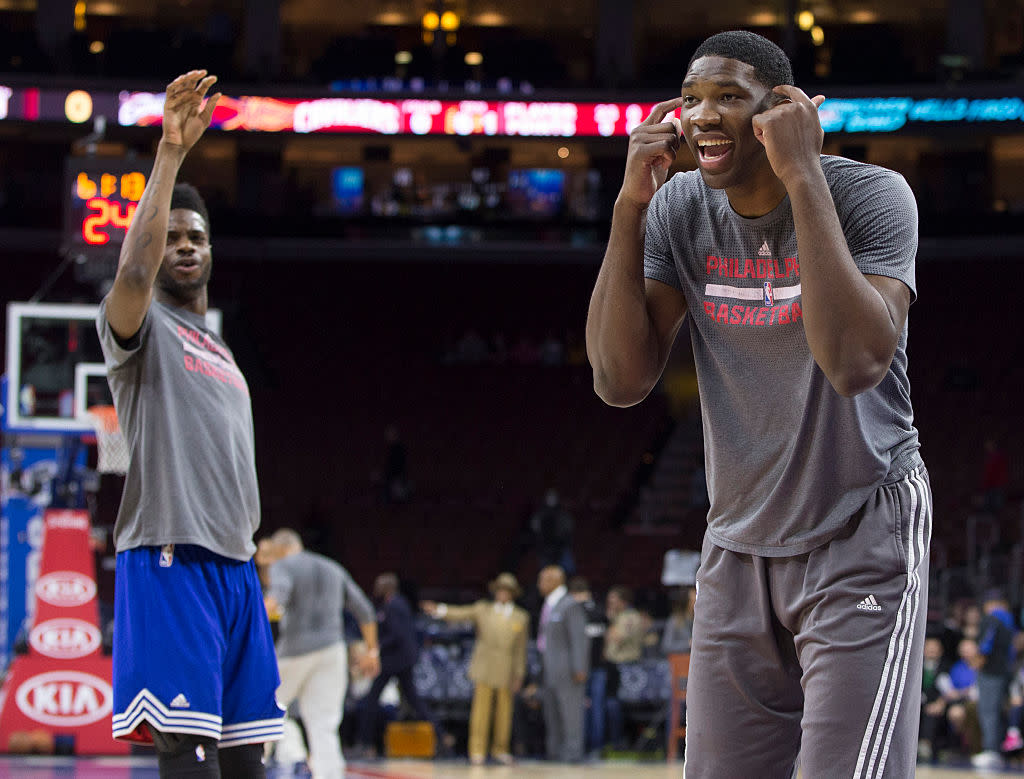 Joel Embiid has fun with Nerlens Noel during warm ups prior to a game against the Cleveland Cavaliers on Jan. 10, 2016. (Mitchell Leff/Getty Images)