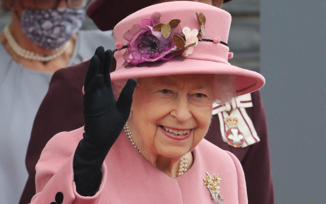 Queen Elizabeth II gestures on her departure after attending the ceremonial opening of the sixth Senedd, in Cardiff, Wales - Geoff Caddick/AFP